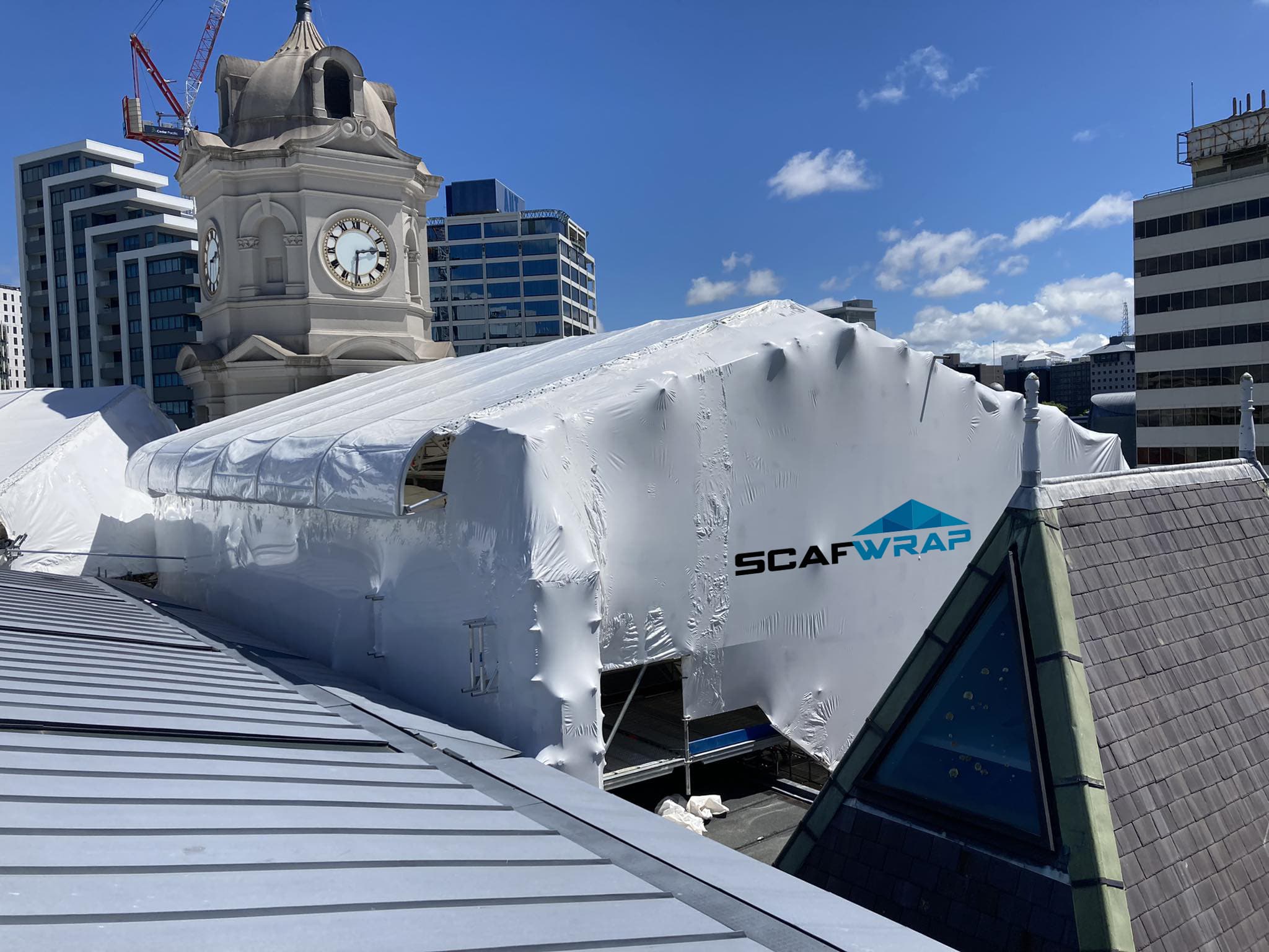 Residential building recladding project with weatherproof shrink wrap in Auckland